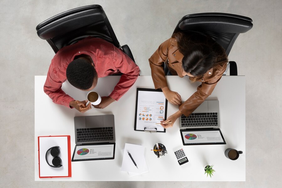 flat-lay-people-working-together_23-2149762524